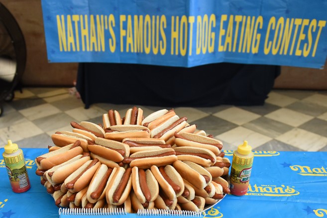 The limits of humanity in hot dog eating and 100m running